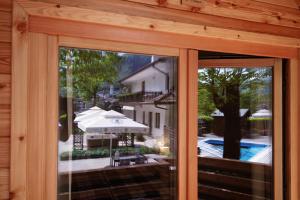 a window of a house with a view of a pool at Penzion Šterk in Most na Soči