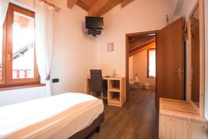 Voodi või voodid majutusasutuse Albergo Maggiorina toas