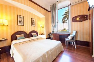 Voodi või voodid majutusasutuse Hotel Miro' toas