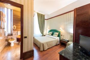 Voodi või voodid majutusasutuse Hotel Miro' toas