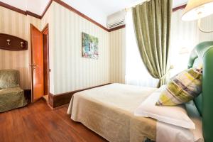 Voodi või voodid majutusasutuse Hotel Miro' toas