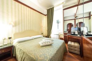 Voodi või voodid majutusasutuse Hotel Miro' toas
