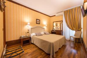Voodi või voodid majutusasutuse Hotel Miro' toas