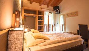 Voodi või voodid majutusasutuse Albergo Maggiorina toas