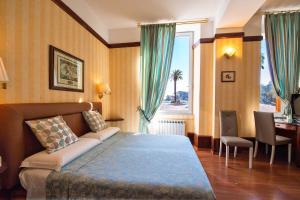 Voodi või voodid majutusasutuse Hotel Miro' toas