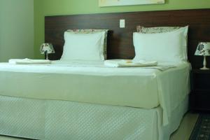 Ένα ή περισσότερα κρεβάτια σε δωμάτιο στο Pousada Maré dos Sonhos