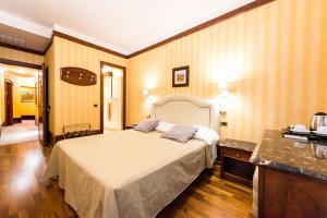 Voodi või voodid majutusasutuse Hotel Miro' toas