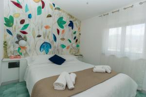 Кровать или кровати в номере Hotel Punto Verde