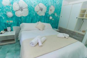 Кровать или кровати в номере Hotel Punto Verde