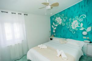 Кровать или кровати в номере Hotel Punto Verde