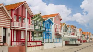 a row of colorful houses on a street at Aveiro Central - It´s ALL there - 2 in Aveiro