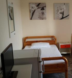Postel nebo postele na pokoji v ubytování Intos Apartments