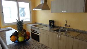 A kitchen or kitchenette at Apartamentos Cala Llonga