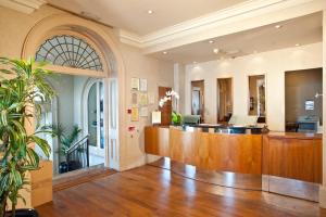 a lobby with a reception desk in a building at Bournemouth East Cliff Hotel, Sure Hotel Collection by BW in Bournemouth