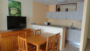 A kitchen or kitchenette at Apartamentos Cala Llonga
