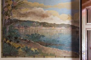 a painting of a painting of a river with a city at Casa Iris Bed and Breakfast in Orbetello