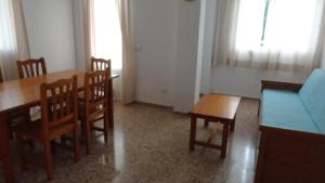 A seating area at Apartamentos Cala Llonga