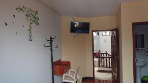 En tv och/eller ett underhållningssystem på Casa Hospedaje Teresita