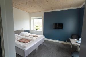 Postel nebo postele na pokoji v ubytování ICV SleepWell