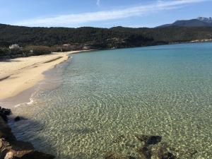 a view of a beach with the sand and water at Hotel Danila in Portoferraio