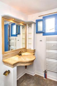 a bathroom with a wooden sink and a mirror at Villa Tina in Arnados +13 photos