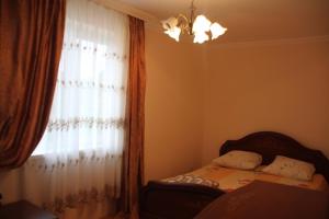 Кровать или кровати в номере Квартира в Пицунде