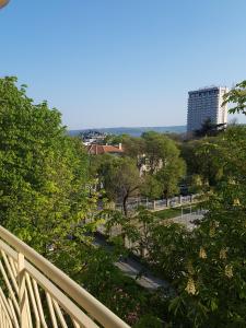 a view of a park with trees and a building at Mommy's House in Varna City