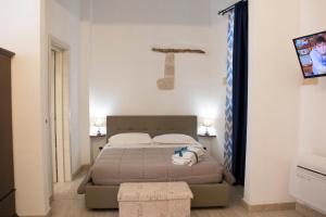 Posteľ alebo postele v izbe v ubytovaní Residenze dello Scirocco