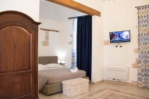 Posteľ alebo postele v izbe v ubytovaní Residenze dello Scirocco