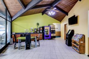 a grocery store with a soda machine in a room at Bloomer Inn & Suites in Bloomer