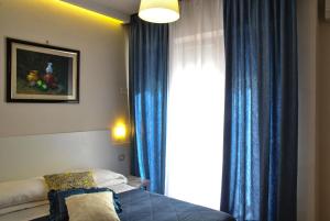 Кровать или кровати в номере Hotel Villa Fiorita