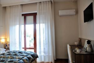 Кровать или кровати в номере Hotel Villa Fiorita