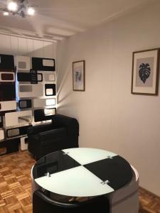 a room with a table and some chairs in a room at Downtown Viamonte Apartment in Buenos Aires