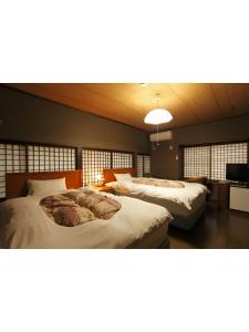 Una cama o camas en una habitación de Tagoto