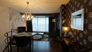 TV a/nebo společenská místnost v ubytování De Keyser Hotel