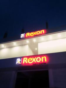 a reynon sign on the side of a gas station at Rexon Residency in Kattappana