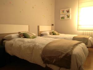 Giường trong phòng chung tại La casa de Marta