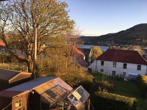 an aerial view of a house and a tree at 25 Windsor Crescent in Portree