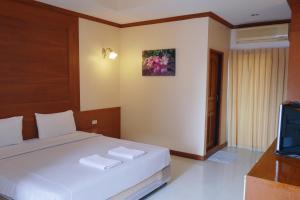 Postel nebo postele na pokoji v ubytování Baan JPN Hotel + 33 fotografií