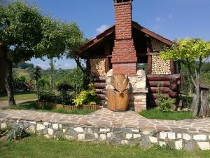 a house with a wooden door in front of it at Holiday Homes Fairy Tale in Varaždin