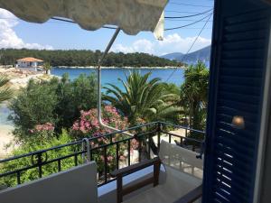 a balcony with a view of the water at Kiki Studios in Fiskardo