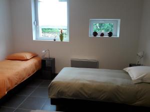 מיטה או מיטות בחדר ב-Gîte Carnot