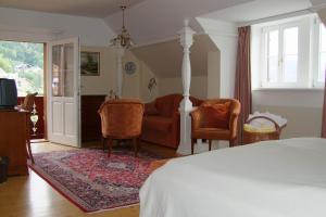 A television and/or entertainment centre at Hotel See-Villa Még 37 kép