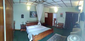 Rúm í herbergi á Manuela Residence