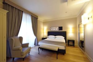 Posteľ alebo postele v izbe v ubytovaní Hotel Palazzo San Lorenzo & Spa