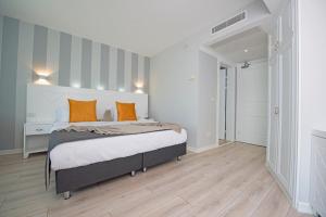 Кровать или кровати в номере Motto Premium Hotel&Spa