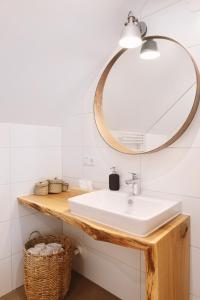 a bathroom with a sink and a mirror at Auszeit beim Oswald in Micheldorf in Oberösterreich