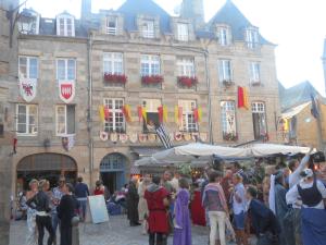 a group of people standing in front of a building at La Tocade Del Arte - Dinan in Lanvallay +27 photos