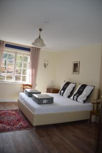 Säng eller sängar i ett rum på Gutshaus Wilhelmsruh