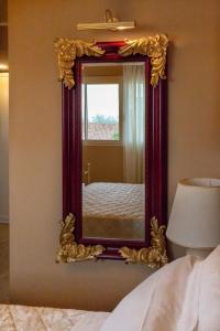 A bed or beds in a room at Villa Luisa Rooms and Breakfast